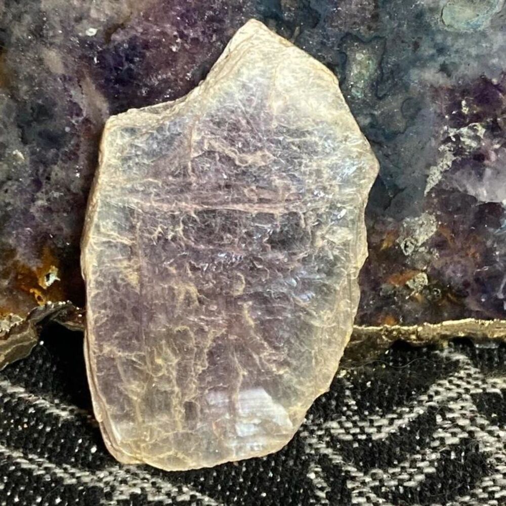 Purple mica crystal slice with natural inclusions